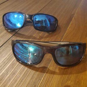 Two pair of Costa sunglasses